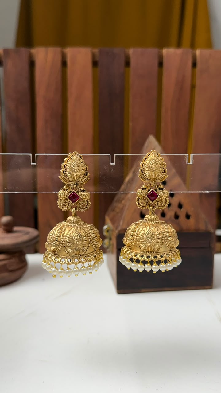 Designer Gold-Plated Temple Jhumki Earrings with Red Stones and White Bead Drops