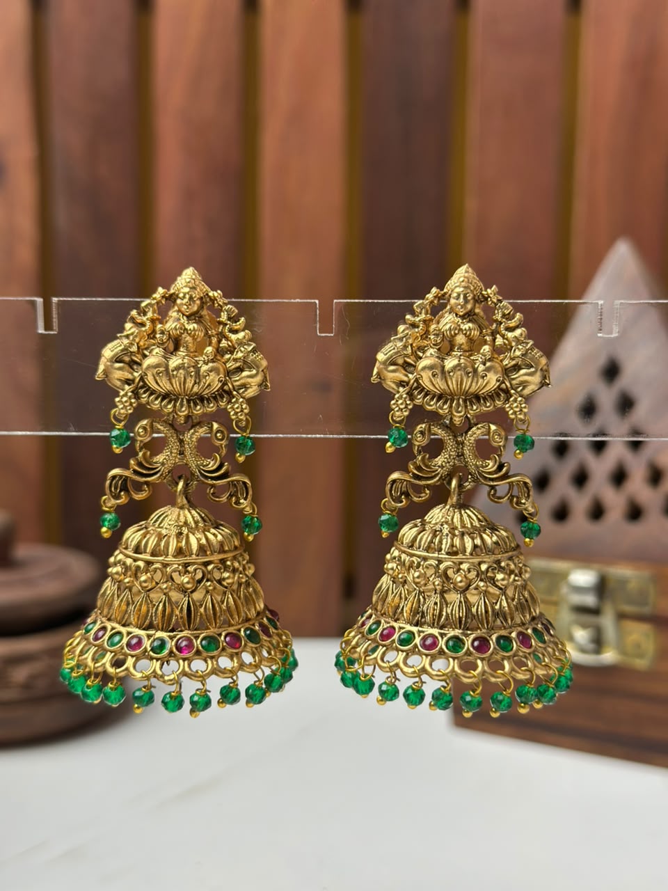 Classic South Indian Jhumki Earrings with Green Stones