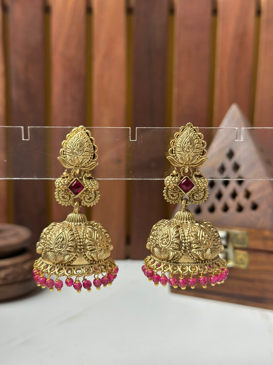 Designer Gold-Plated Temple Jhumki Earrings with Red Bead Drops